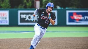 Louisiana Tech catcher Jorge Corona (11) scores an inside the park